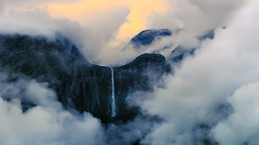 Image of waterfall from distance with clouds