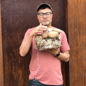 Person holding something with cord.