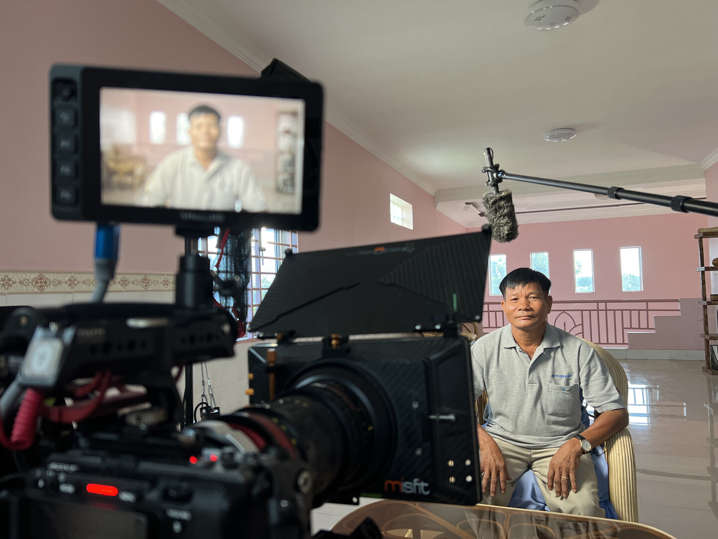 Person in front of camera and monitors.