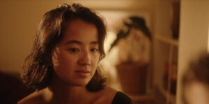 Person inside looking down.