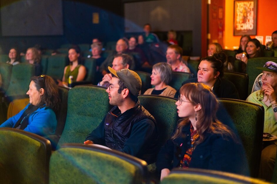 People in theater looking forward.
