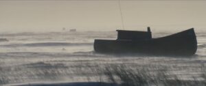 Boat in snowy landscape.