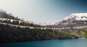 Flags over water with mountain in background.