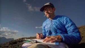 Person drawing outside.