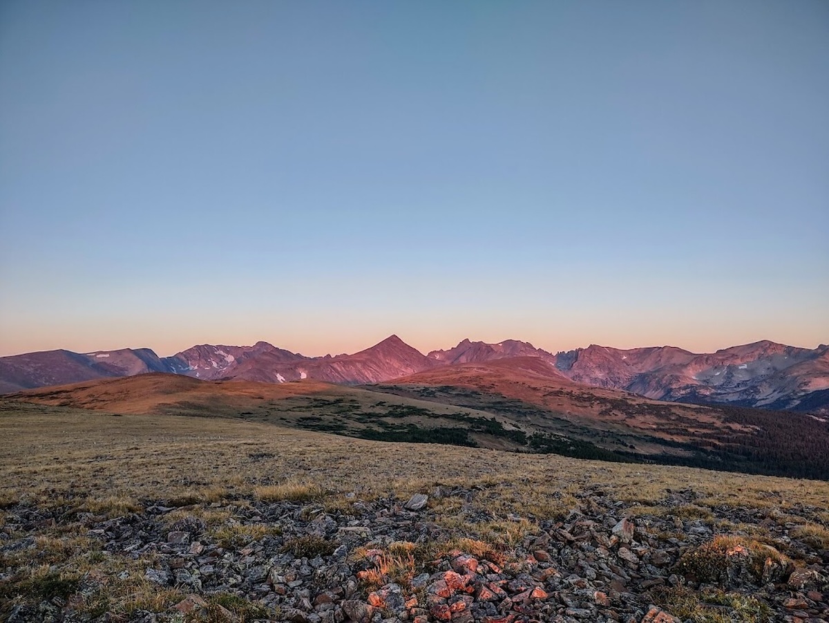 Wide shot of open plain and mountians.