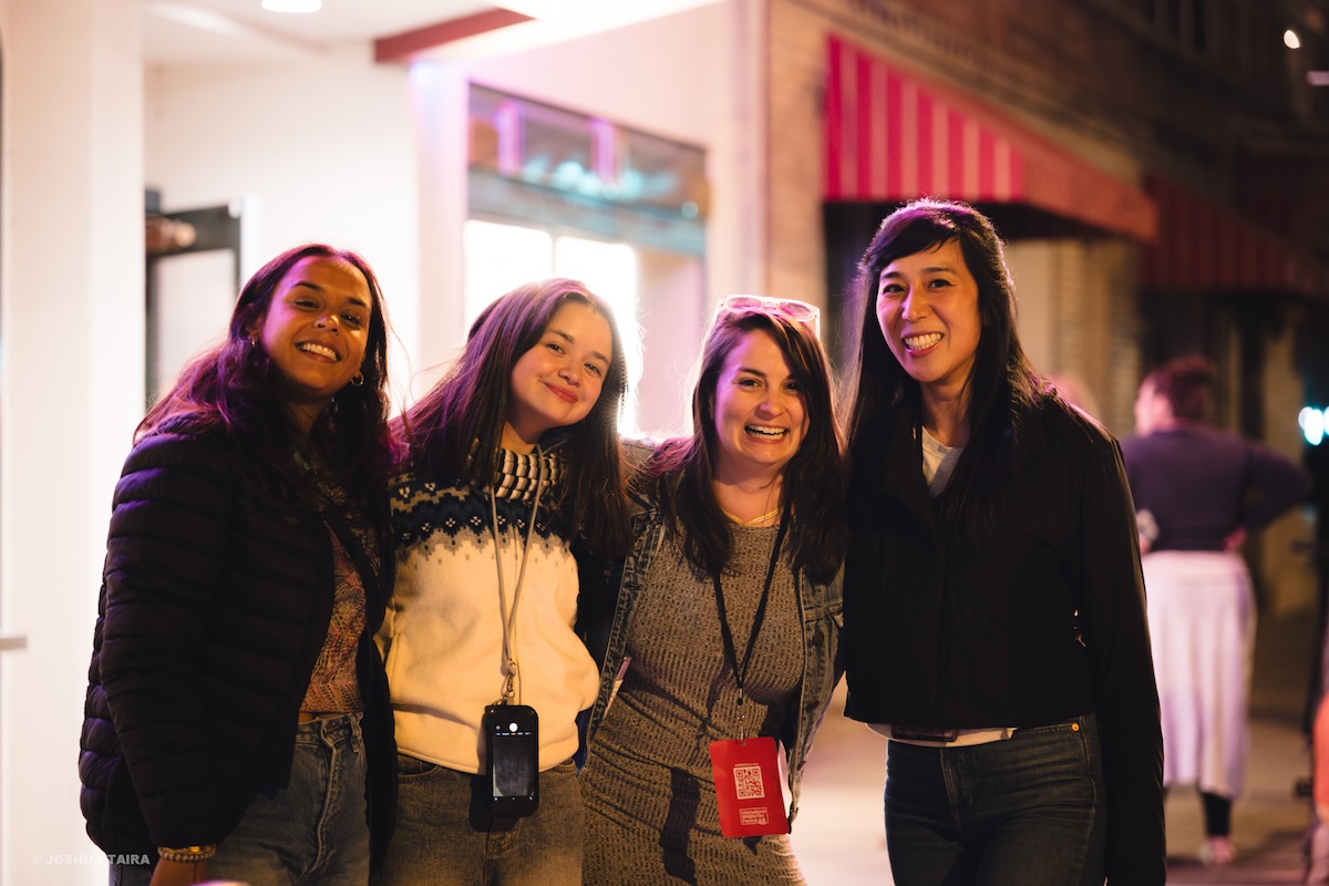 People outside smiling.