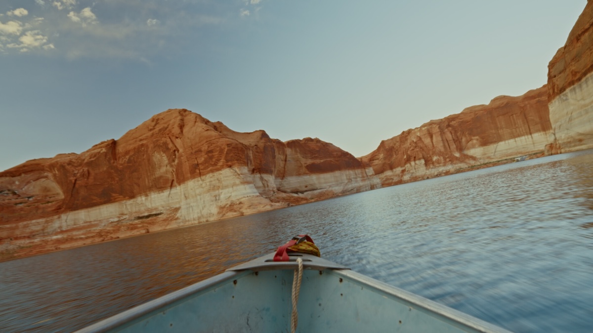 View from canoe of water and canyon.
