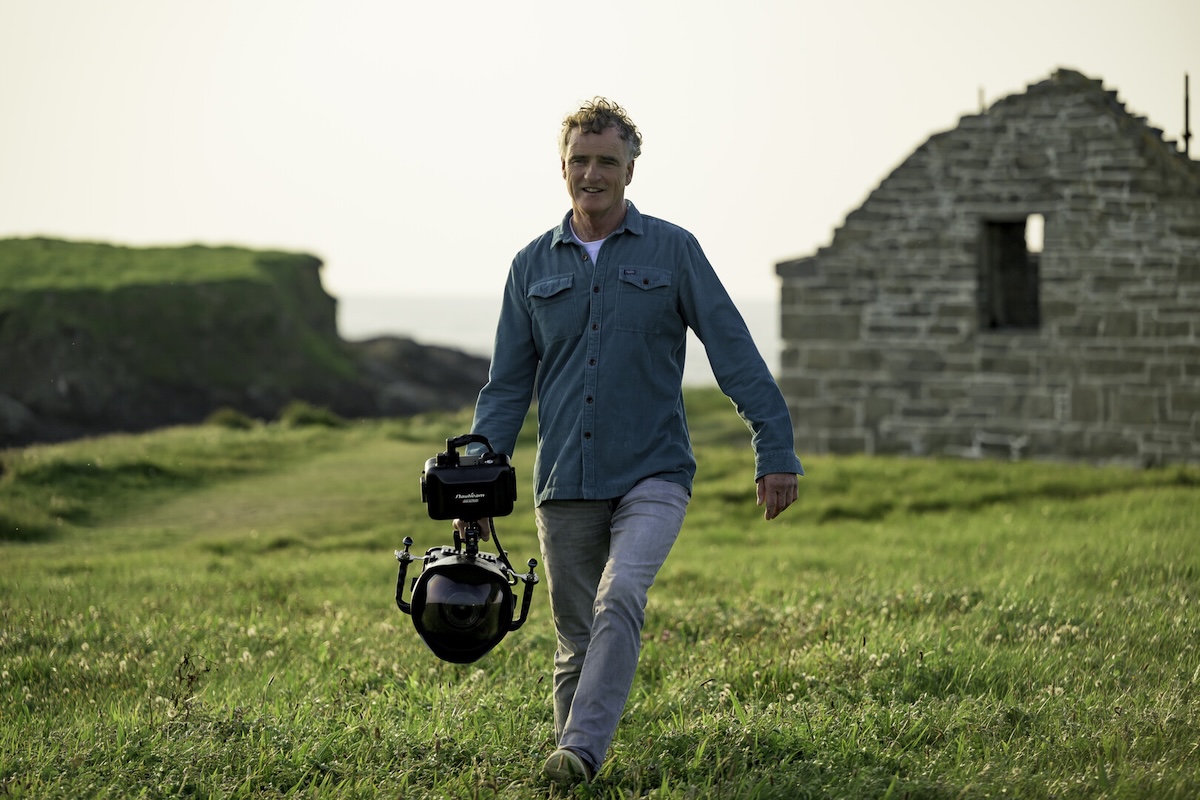 Person walking with camera.